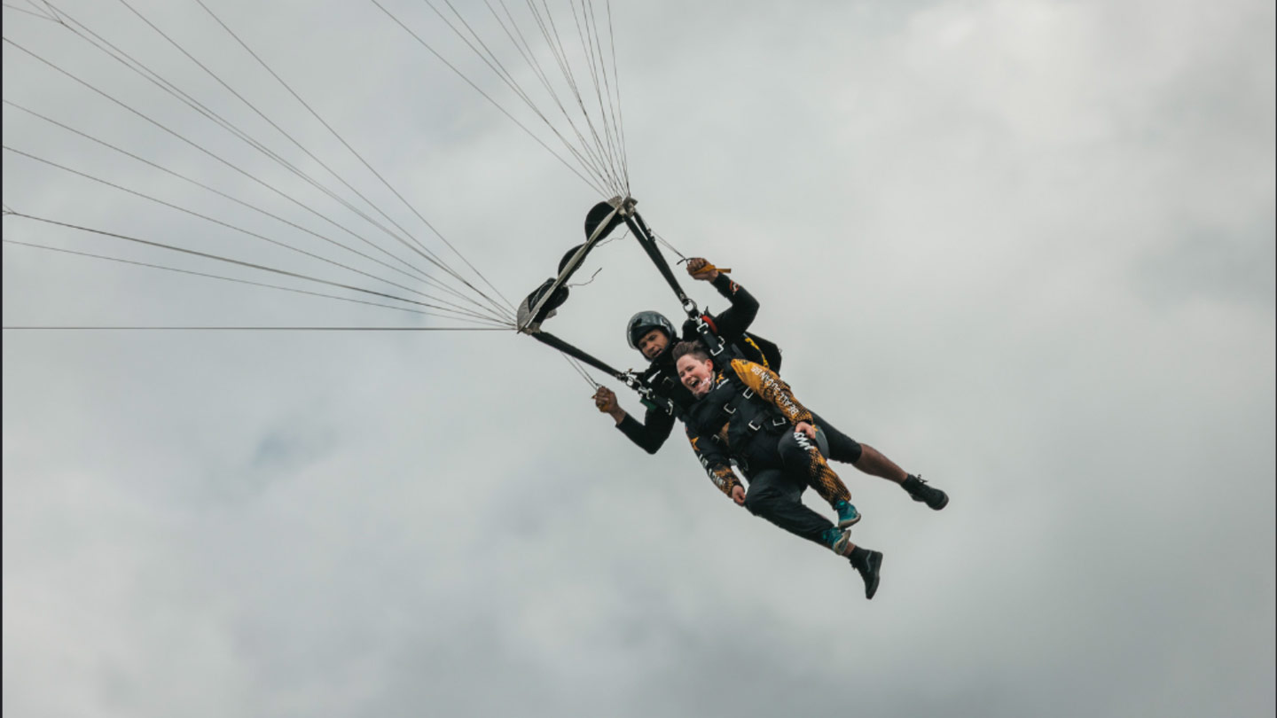 Assistant Director Kristie Furiosi parachuting with the Army Golden Knights!