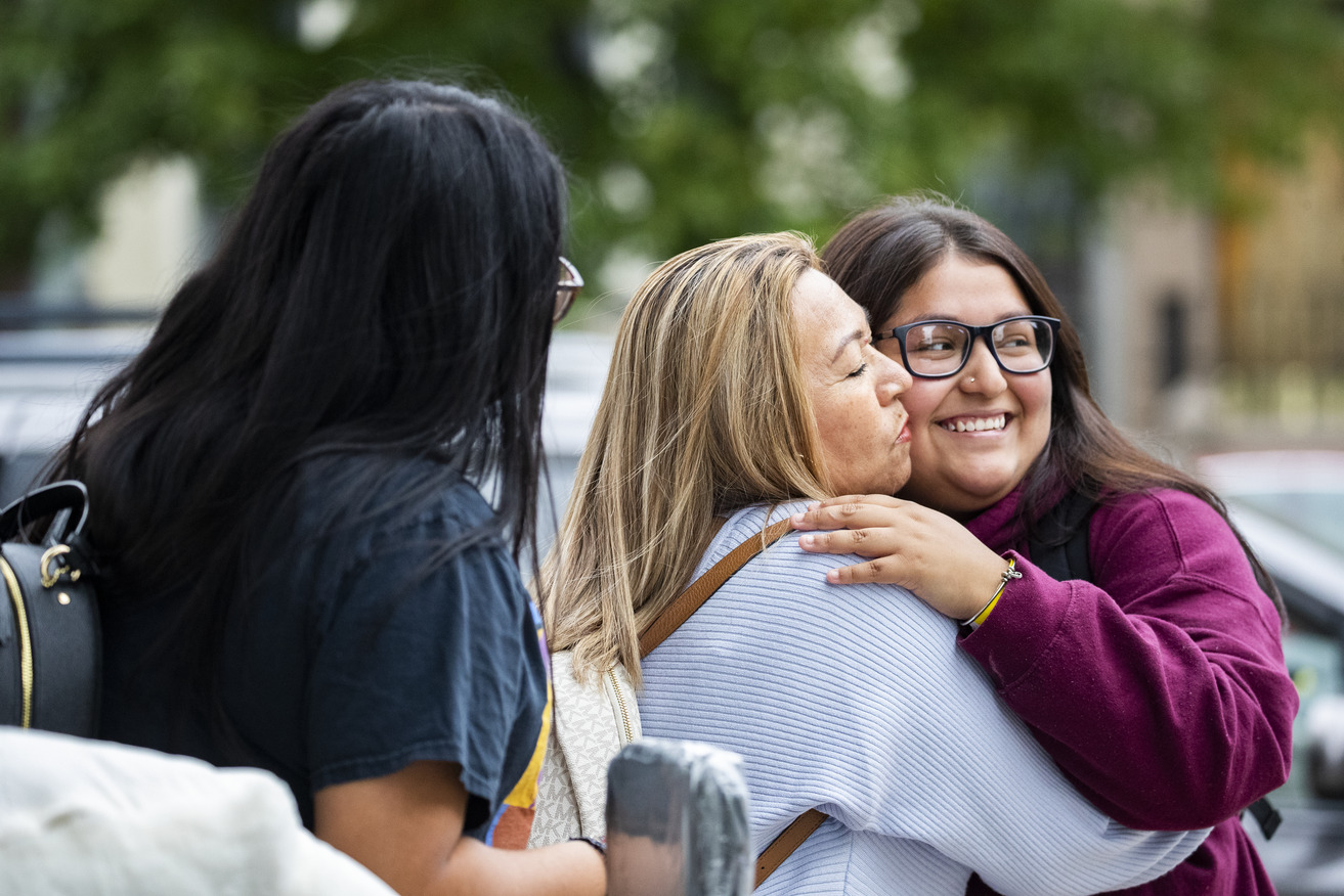 Mom and daughter smiling for photo at move in