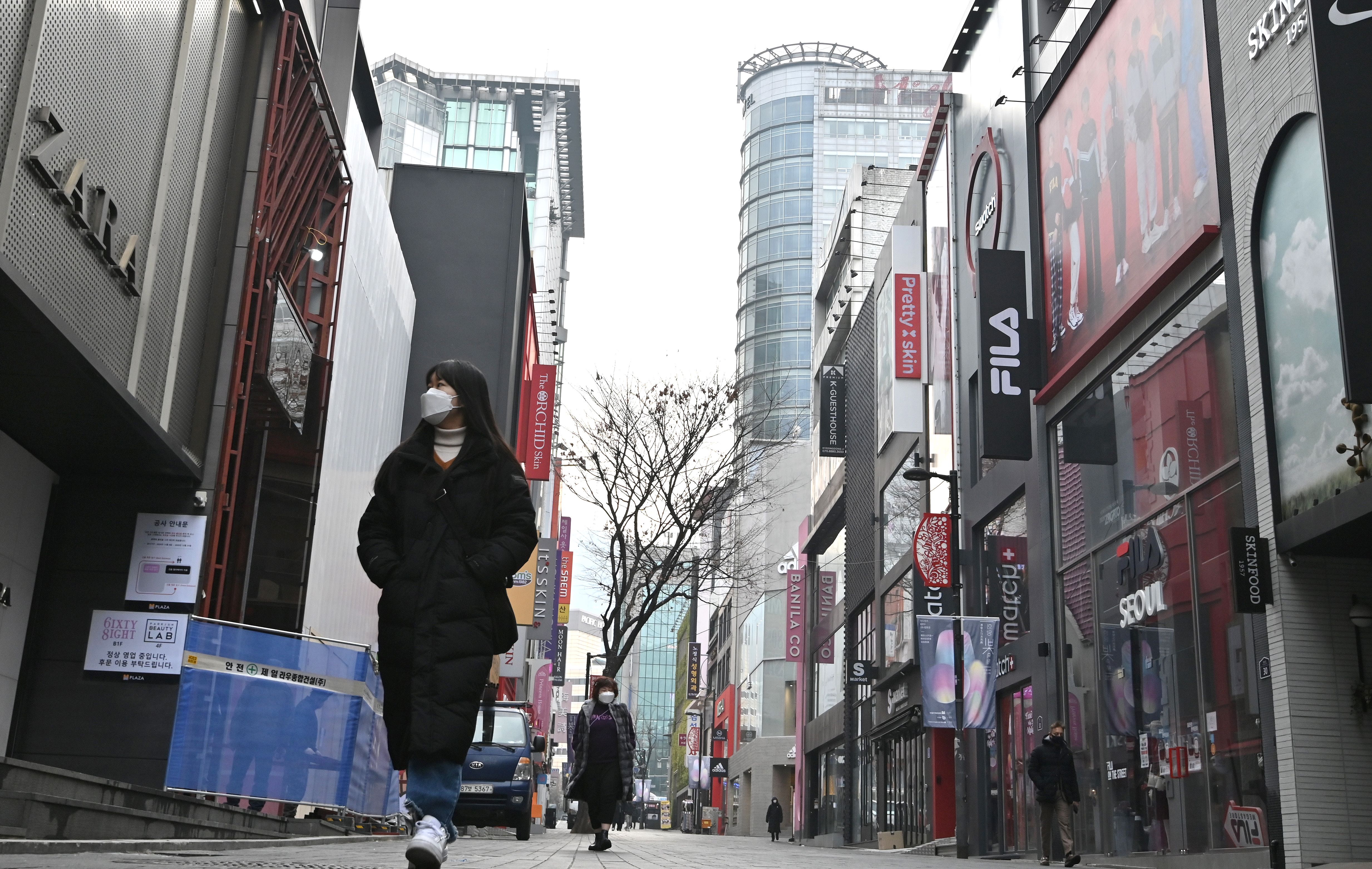 As omicron pushes the West to reopen, Asia hunkers down